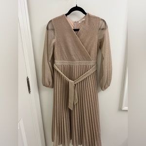 Champagne-coloured sparkly ankle-length dress.